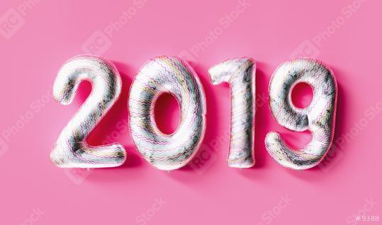 New year 2019 celebration. white colored numeral 2019 and confetti on pink background. New Year