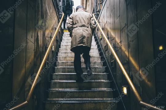 nknown older man walking up the old stone stairs during rain  : Stock Photo or Stock Video Download rcfotostock photos, images and assets rcfotostock | RC Photo Stock.: