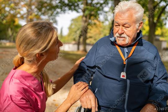 Nurse holding an elderly man