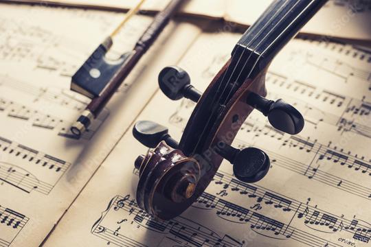 old antique Violin head with bow on notes  : Stock Photo or Stock Video Download rcfotostock photos, images and assets rcfotostock | RC Photo Stock.: