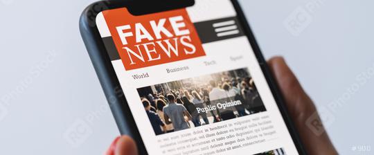 Online fake news on a mobile phone. Close up of woman reading Fake news HOAX or articles in a smartphone screen application. Hand holding smart device. Mockup website. Fake Newspaper portal.  : Stock Photo or Stock Video Download rcfotostock photos, images and assets rcfotostock | RC Photo Stock.: