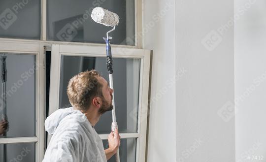 painter look to the wall with paint roller and think about his work  : Stock Photo or Stock Video Download rcfotostock photos, images and assets rcfotostock | RC Photo Stock.: