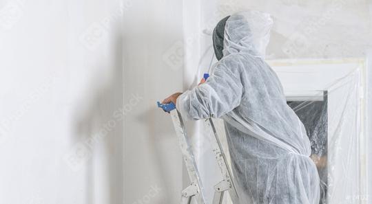 painter stands with paint roller on a ladder to paint the room window with white color. do it yourself concept image  : Stock Photo or Stock Video Download rcfotostock photos, images and assets rcfotostock | RC Photo Stock.: