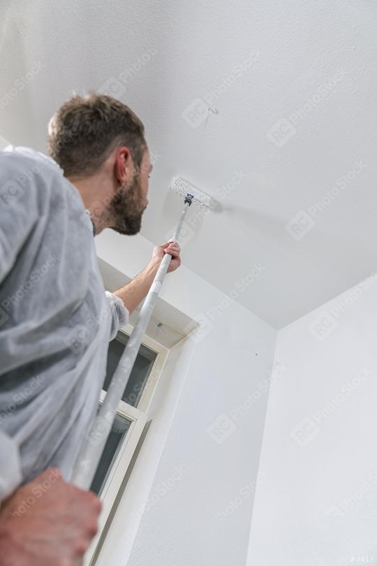 painter working with paint roller to paint the ceiling of a room with white color. do it yourself concept image  : Stock Photo or Stock Video Download rcfotostock photos, images and assets rcfotostock | RC Photo Stock.: