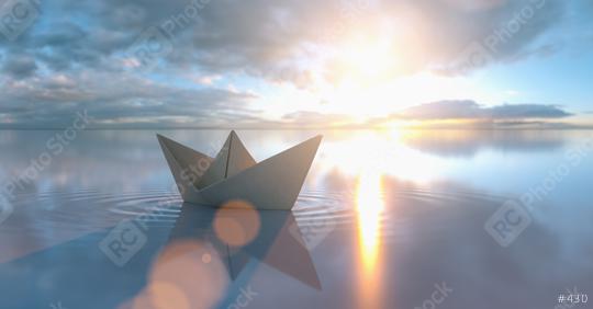 Paper boat in a calm sea at sunrise sunset with cloudy sky  : Stock Photo or Stock Video Download rcfotostock photos, images and assets rcfotostock | RC Photo Stock.: