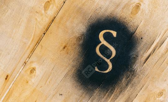 Paragraph sign sprayed on a wood plate - Symbol of Law and Justice  : Stock Photo or Stock Video Download rcfotostock photos, images and assets rcfotostock | RC Photo Stock.: