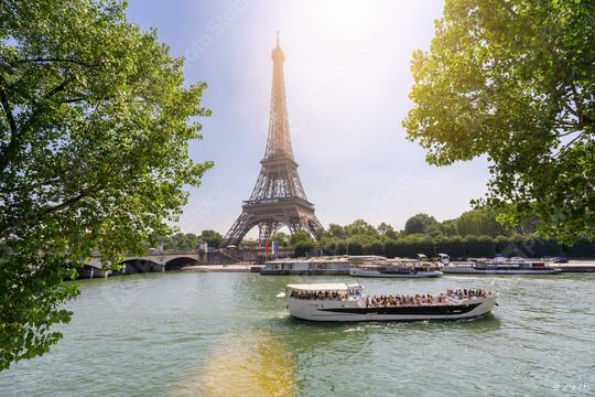 Paris Eiffel Tower and river Seine at summer in Paris, France. Eiffel Tower is one of the most iconic landmarks of Paris.   : Stock Photo or Stock Video Download rcfotostock photos, images and assets rcfotostock | RC Photo Stock.: