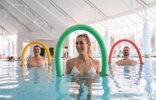 Patients during remobilization in a health center doing aquarobics with pool noodle in the water of a pool  : Stock Photo or Stock Video Download rcfotostock photos, images and assets rcfotostock | RC Photo Stock.: