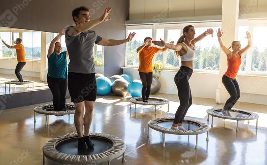 People in a fitness class performing exercises on mini trampolines in a gym  : Stock Photo or Stock Video Download rcfotostock photos, images and assets rcfotostock | RC Photo Stock.: