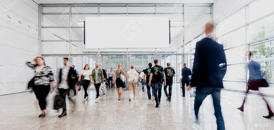 People on trade fair under a blank advertising poster or banner  : Stock Photo or Stock Video Download rcfotostock photos, images and assets rcfotostock | RC Photo Stock.: