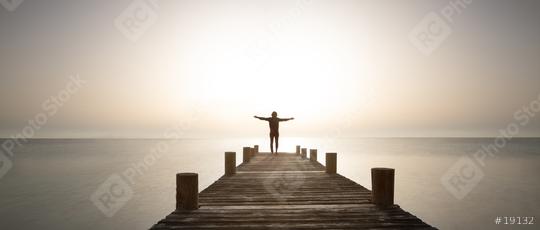 Person stands with open arms on wooden path at sunrise. Powerful mediations, relaxation, recharge your batteries and enjoy life.  : Stock Photo or Stock Video Download rcfotostock photos, images and assets rcfotostock | RC Photo Stock.: