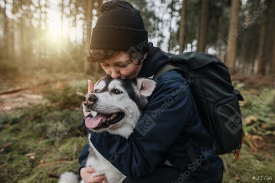 Person with a cute white-black husky dog in the forest. Autumn mood. Enjoy life and lovely friendship with with a pet.   : Stock Photo or Stock Video Download rcfotostock photos, images and assets rcfotostock | RC Photo Stock.: