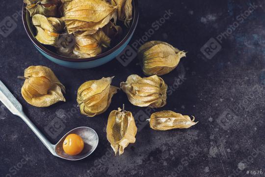 Physalis fruits (Physalis Peruviana) with in a ceramic bowl and spoon on dark background  : Stock Photo or Stock Video Download rcfotostock photos, images and assets rcfotostock | RC Photo Stock.:
