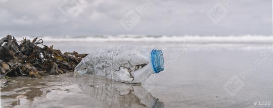 plastic bottle on the shore, copyspace for your individual text, banner size  : Stock Photo or Stock Video Download rcfotostock photos, images and assets rcfotostock | RC Photo Stock.: