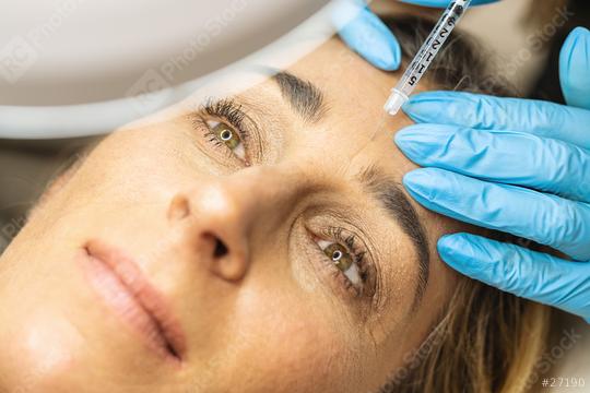 Plastic Surgery. Young Woman Receiving Anti-aging face Injection in forehead at a Beauty Clinic  : Stock Photo or Stock Video Download rcfotostock photos, images and assets rcfotostock | RC Photo Stock.: