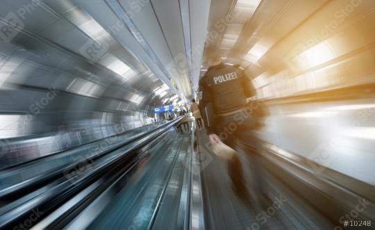 Police man at a walking on a airport  : Stock Photo or Stock Video Download rcfotostock photos, images and assets rcfotostock | RC Photo Stock.: