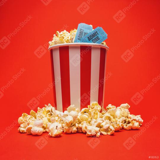 Popcorn box with cinema movie tickets on a bright red background  : Stock Photo or Stock Video Download rcfotostock photos, images and assets rcfotostock | RC Photo Stock.: