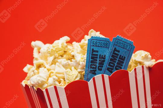 popcorn in striped box with two tickets to the cinema on red background  : Stock Photo or Stock Video Download rcfotostock photos, images and assets rcfotostock | RC Photo Stock.: