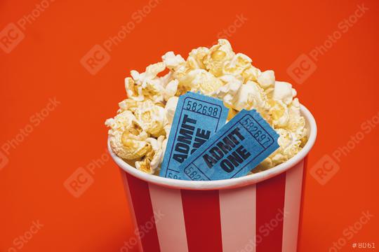 Popcorn with cinema movie in a round box and around on a bright red background.  : Stock Photo or Stock Video Download rcfotostock photos, images and assets rcfotostock | RC Photo Stock.: