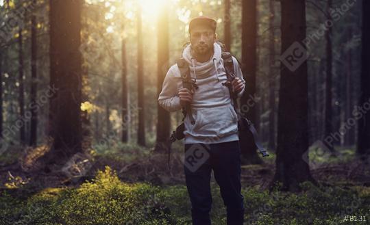 Portrait of a young hiker with backpack in the forest at a summer day  : Stock Photo or Stock Video Download rcfotostock photos, images and assets rcfotostock | RC Photo Stock.: