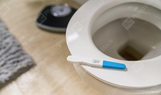 positive pregnancy test stick on a toilet  : Stock Photo or Stock Video Download rcfotostock photos, images and assets rcfotostock | RC Photo Stock.:
