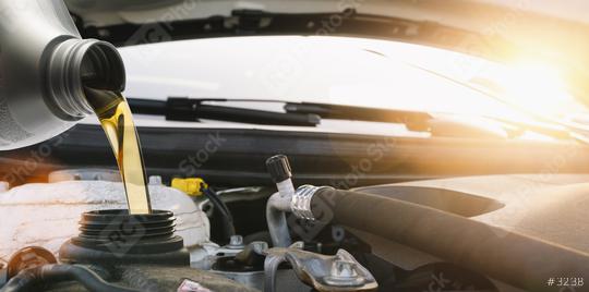 Pouring motor oil to car engine, Fresh oil poured during an oil change to a car.  : Stock Photo or Stock Video Download rcfotostock photos, images and assets rcfotostock | RC Photo Stock.: