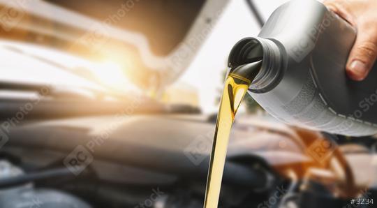 Pouring oil to car engine  : Stock Photo or Stock Video Download rcfotostock photos, images and assets rcfotostock | RC Photo Stock.: