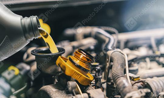 Pouring oil to car engine. Fresh oil poured during an oil change to a car.  : Stock Photo or Stock Video Download rcfotostock photos, images and assets rcfotostock | RC-Photo-Stock.: