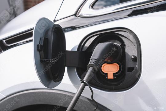 Power supply for electric car charging. Electric car charging station. Close up of the power supply plugged into an electric car being charged.  : Stock Photo or Stock Video Download rcfotostock photos, images and assets rcfotostock | RC Photo Stock.: