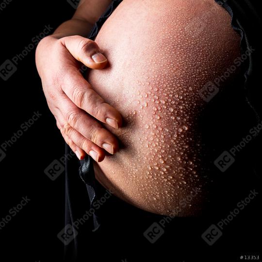Pregnant woman belly with drops of water  : Stock Photo or Stock Video Download rcfotostock photos, images and assets rcfotostock | RC-Photo-Stock.: