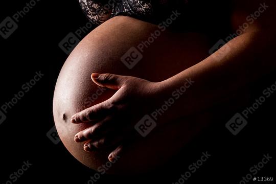 Pregnant woman caressing her belly   : Stock Photo or Stock Video Download rcfotostock photos, images and assets rcfotostock | RC Photo Stock.: