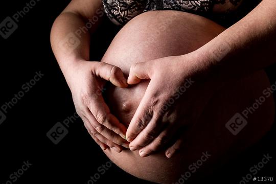 Pregnant woman holding her hands in heart shape  : Stock Photo or Stock Video Download rcfotostock photos, images and assets rcfotostock | RC Photo Stock.: