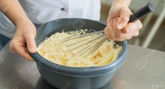 professional baker woman holding bowl with whisk to beat butter until stiff at a bakery  : Stock Photo or Stock Video Download rcfotostock photos, images and assets rcfotostock | RC Photo Stock.: