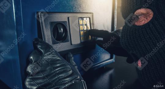 Professional burglar in black ski mask opened a small safe  : Stock Photo or Stock Video Download rcfotostock photos, images and assets rcfotostock | RC Photo Stock.: