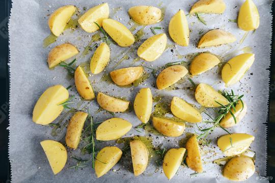 raw potato wedges on baking tray  : Stock Photo or Stock Video Download rcfotostock photos, images and assets rcfotostock | RC Photo Stock.: