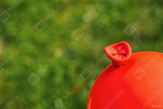 Red ballon knot against green background, copyspace for your individual text.  : Stock Photo or Stock Video Download rcfotostock photos, images and assets rcfotostock | RC Photo Stock.: