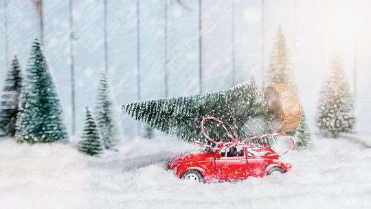 red car carrying a Christmas tree in a snow covered miniature evergreen forest landscape  : Stock Photo or Stock Video Download rcfotostock photos, images and assets rcfotostock | RC Photo Stock.: