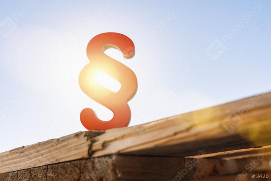 red paragraph sign with sun flare as a symbol for idea of law and justice  : Stock Photo or Stock Video Download rcfotostock photos, images and assets rcfotostock | RC Photo Stock.: