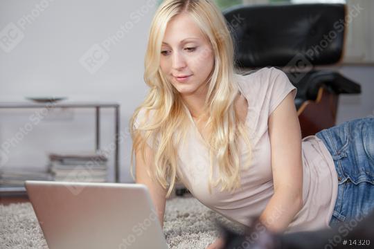 Relaxed woman is using laptop  : Stock Photo or Stock Video Download rcfotostock photos, images and assets rcfotostock | RC Photo Stock.: