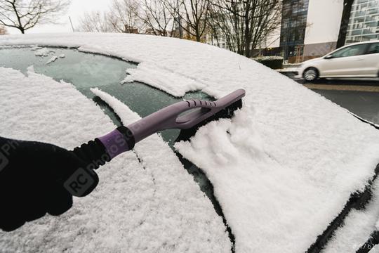 Removing snow from car windiow with a brush  : Stock Photo or Stock Video Download rcfotostock photos, images and assets rcfotostock | RC Photo Stock.: