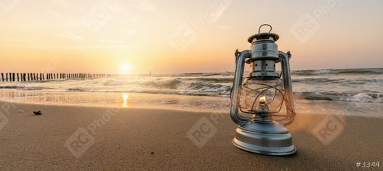 romantic evening at the beach, vintage lantern at sunset, banner size, copyspace for your individual text  : Stock Photo or Stock Video Download rcfotostock photos, images and assets rcfotostock | RC Photo Stock.: