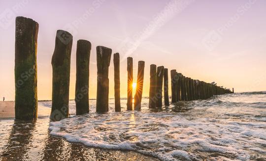 Sandy beach with breakwaters at sunset  : Stock Photo or Stock Video Download rcfotostock photos, images and assets rcfotostock | RC Photo Stock.: