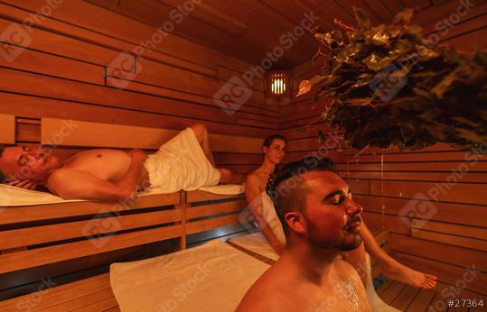 sauna session with a man enjoying a vihta treatment and others relaxing in the wooden room at a finnish sauna. Wellness Spa Hotel Conept image.  : Stock Photo or Stock Video Download rcfotostock photos, images and assets rcfotostock | RC Photo Stock.:
