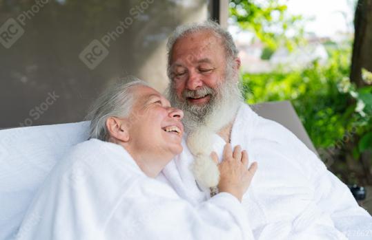 Senior couple in love look at each other relaxing together on bed lounge at wellness spa resort. Senior Moments concept image  : Stock Photo or Stock Video Download rcfotostock photos, images and assets rcfotostock | RC Photo Stock.: