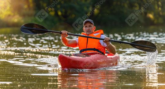 Senior Kayaker on a river. Kayak Water Sports concept image  : Stock Photo or Stock Video Download rcfotostock photos, images and assets rcfotostock | RC Photo Stock.: