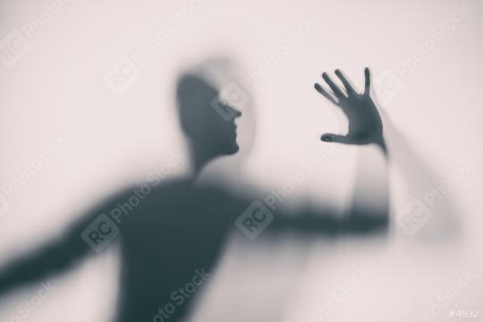 Shadowy human figure behind a frosted glass  : Stock Photo or Stock Video Download rcfotostock photos, images and assets rcfotostock | RC Photo Stock.: