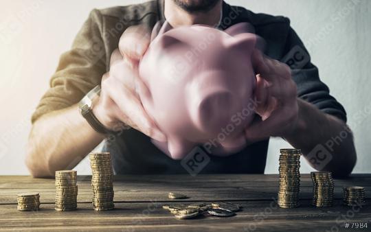 shaking piggy bank and getting coins  : Stock Photo or Stock Video Download rcfotostock photos, images and assets rcfotostock | RC Photo Stock.: