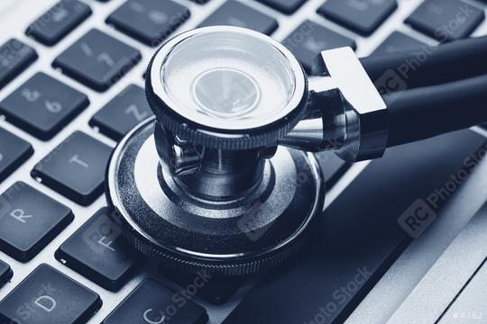 Silver stethoscope lying down on an laptop  : Stock Photo or Stock Video Download rcfotostock photos, images and assets rcfotostock | RC Photo Stock.:
