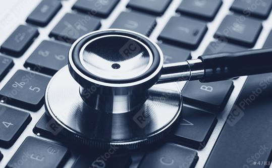 Silver stethoscope lying down on an laptop, blue toned   : Stock Photo or Stock Video Download rcfotostock photos, images and assets rcfotostock | RC Photo Stock.: