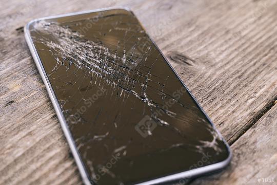 Smartphone display with broken glass on a wodden table  : Stock Photo or Stock Video Download rcfotostock photos, images and assets rcfotostock | RC Photo Stock.: